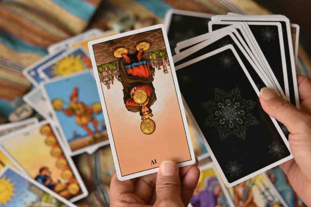 Releasing the Grip: 4 of Pentacles Reversed Tarot Meaning