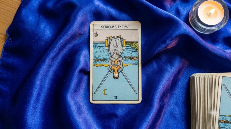 2 of Swords Reversed Meaning for Love and Life